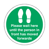 Please Wait Until Person In Front Has Moved Floor Sticker - Green | Safety-Label.co.uk